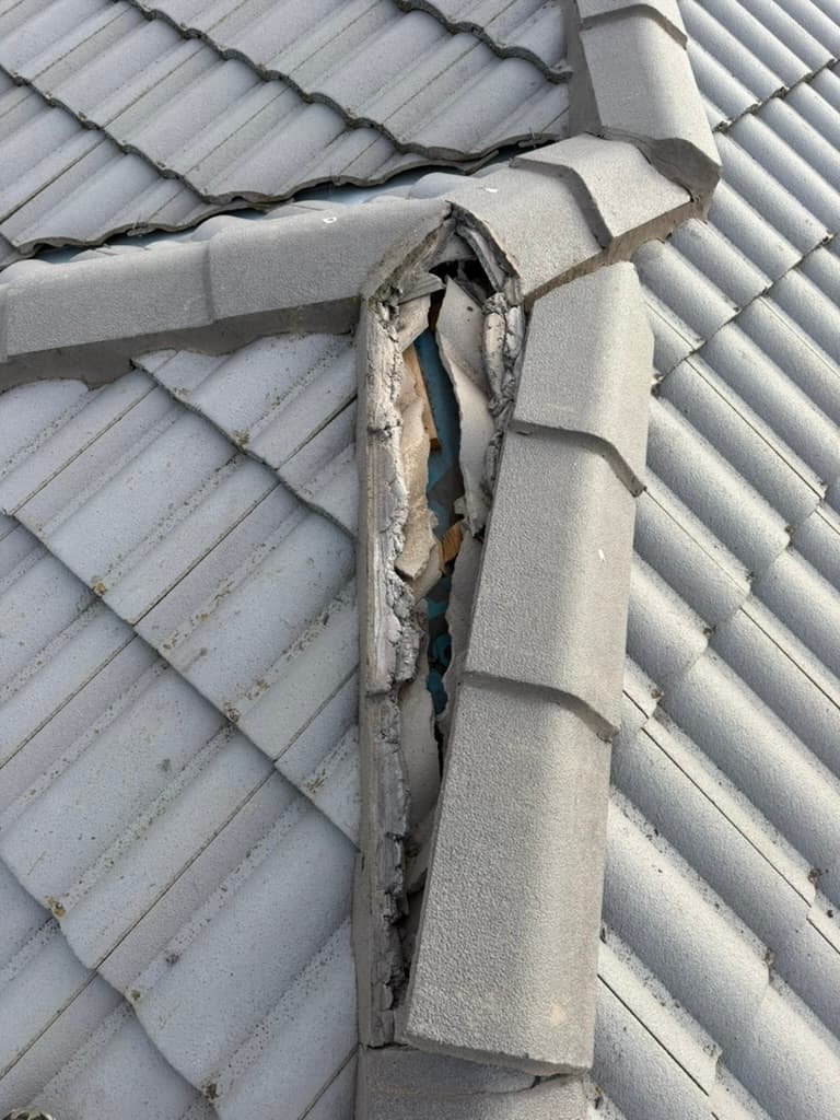 Cracked ridge cap tile roof damage – Skyways Roofing