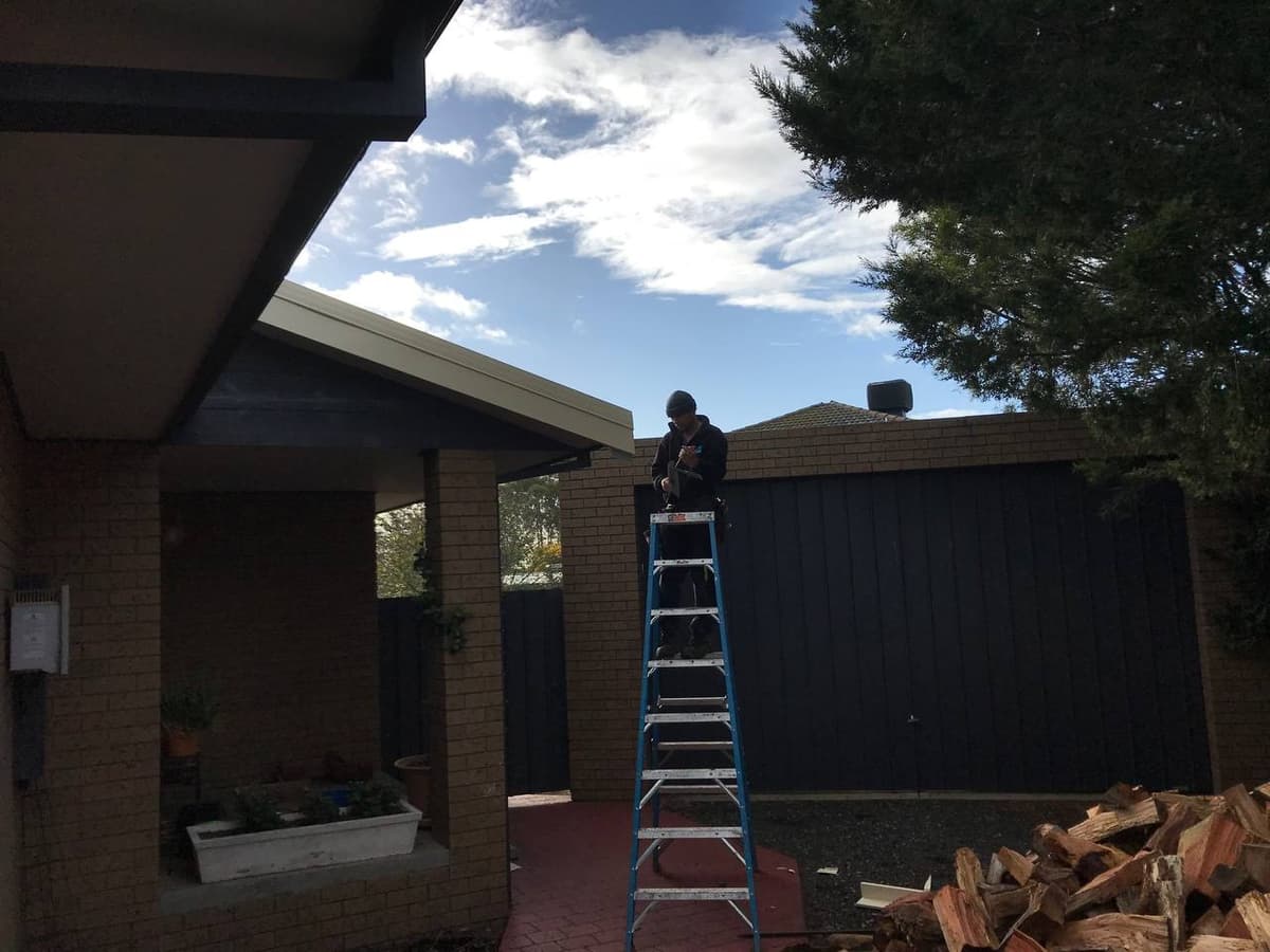 Gutter inspection from ladder – Skyways Roofing